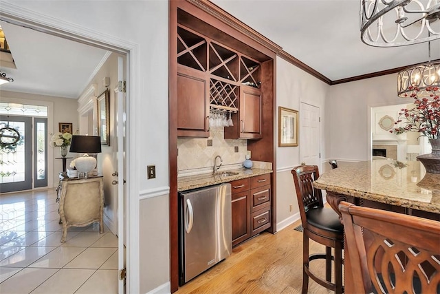 213 Five Pounds Rd, Saint Simons Island, GA 31522 - kitchen featuring refrigerator, ornamental molding, backsplash, a chandelier, and baseboards