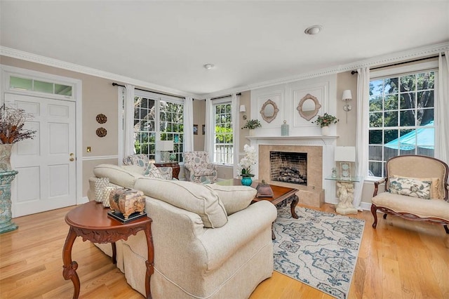 213 Five Pounds Rd, Saint Simons Island, GA 31522 - living area with wood finished floors, a high end fireplace, and crown molding