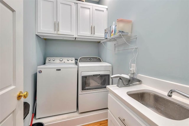 213 Five Pounds Rd, Saint Simons Island, GA 31522 - laundry area featuring washer and clothes dryer and cabinet space