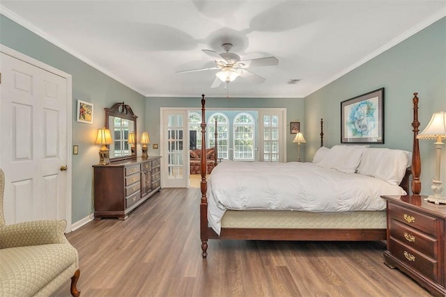 213 Five Pounds Rd, Saint Simons Island, GA 31522 - bedroom with access to exterior, a ceiling fan, wood finished floors, baseboards, and ornamental molding