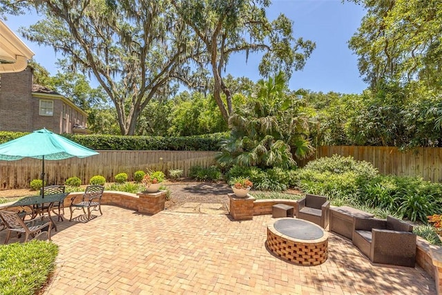 213 Five Pounds Rd, Saint Simons Island, GA 31522 - fenced backyard featuring a patio