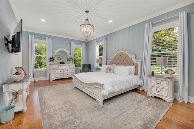 213 Five Pounds Rd, Saint Simons Island, GA 31522 - bedroom with a chandelier, wood finished floors, crown molding, recessed lighting, and baseboards