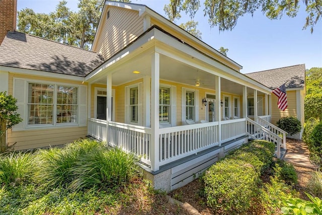 213 Five Pounds Rd, Saint Simons Island, GA 31522 - view of front of home with covered porch and a shingled roof