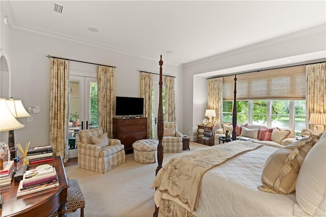 bedroom featuring ornamental molding, french doors, multiple windows, and visible vents