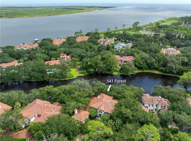 birds eye view of property with a water view and a residential view