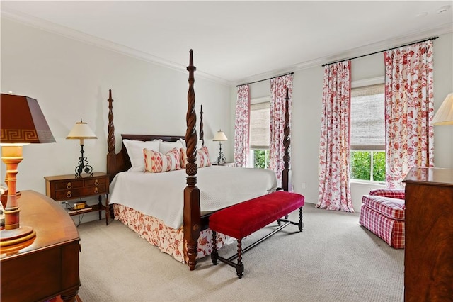 bedroom with carpet floors and crown molding