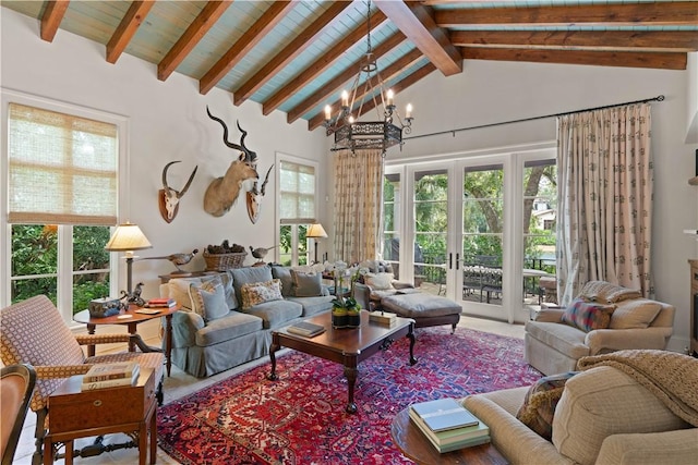 sunroom featuring a chandelier, french doors, a healthy amount of sunlight, and lofted ceiling with beams