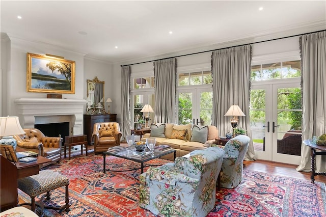 living room featuring ornamental molding, french doors, and a wealth of natural light