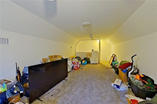 playroom with carpet floors, vaulted ceiling, and visible vents
