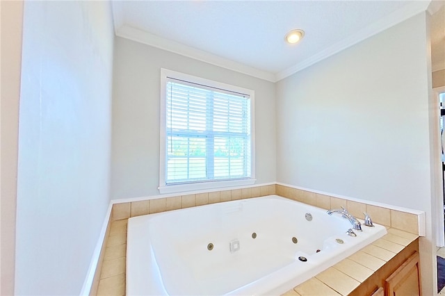 bathroom featuring crown molding, tile patterned floors, a tub with jets, and baseboards