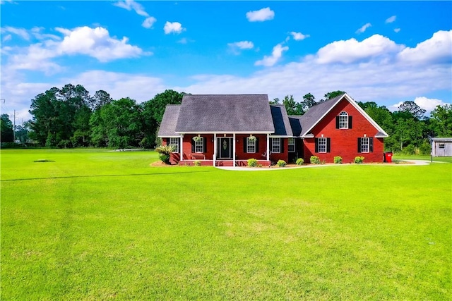 view of front of home featuring covered porch and a front yard