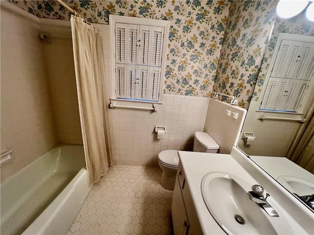 full bathroom featuring vanity, tile patterned floors, toilet, tile walls, and shower / tub combo with curtain