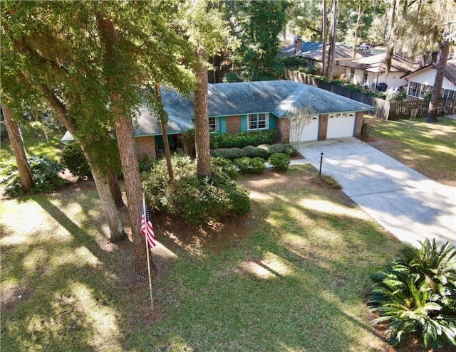 single story home with a front yard and a garage