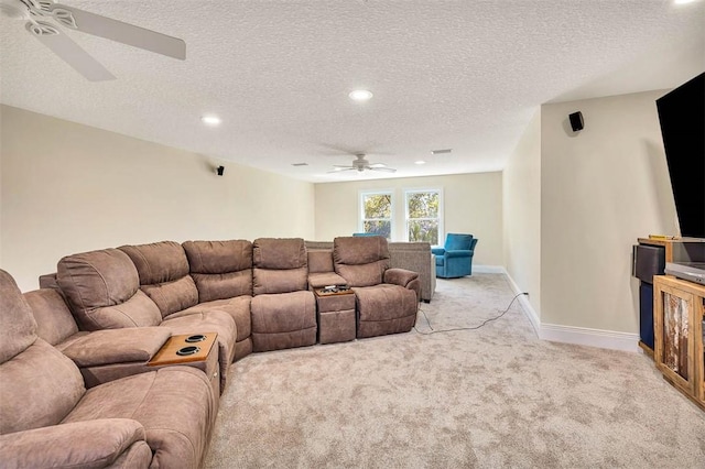 carpeted living room with a textured ceiling and ceiling fan