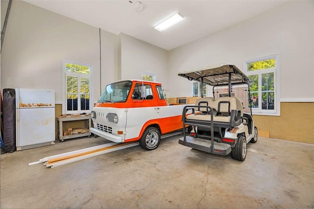 garage with white fridge