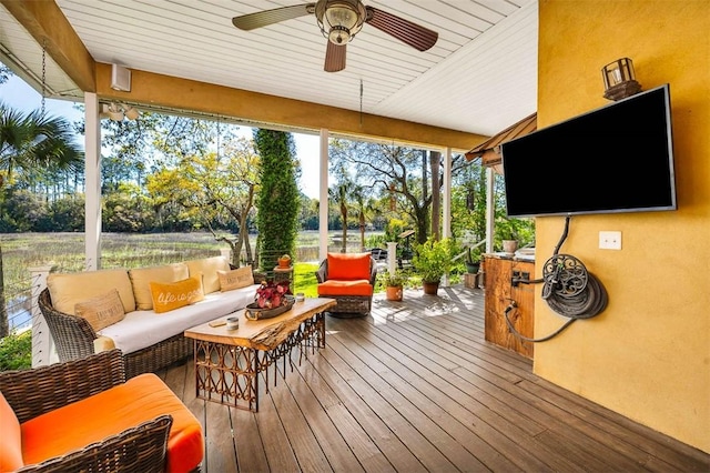 wooden terrace featuring outdoor lounge area