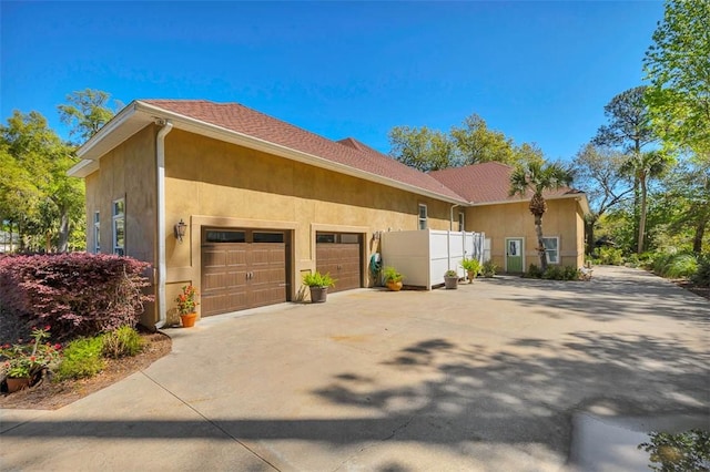 view of side of property featuring a garage