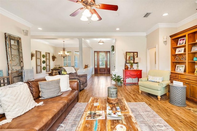 living room featuring light hardwood / wood-style flooring and ornamental molding