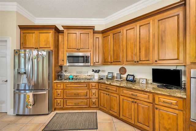 kitchen featuring appliances with stainless steel finishes, a textured ceiling, and crown molding