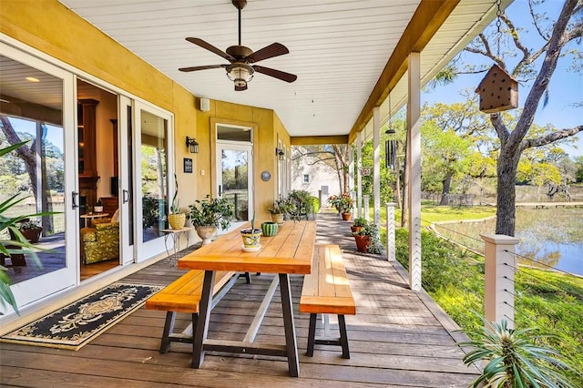 sunroom featuring ceiling fan and a healthy amount of sunlight