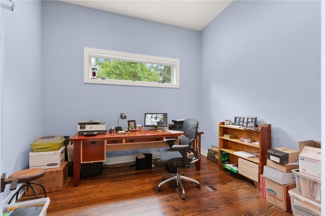 home office with dark wood-type flooring