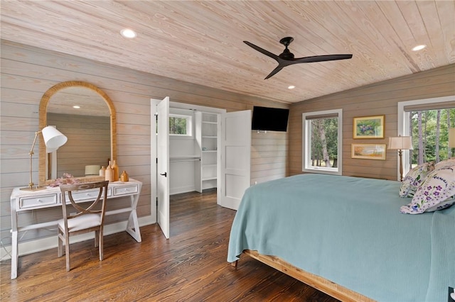 bedroom featuring wood walls, lofted ceiling, wooden ceiling, ceiling fan, and dark hardwood / wood-style flooring