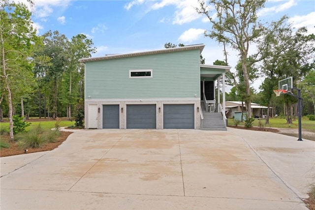 view of side of property with a garage