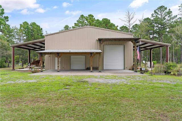 exterior space featuring a garage and a lawn