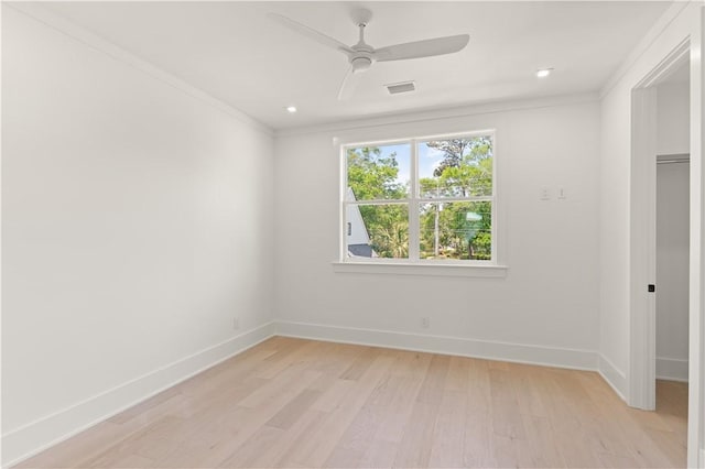 unfurnished bedroom featuring baseboards, ornamental molding, and visible vents