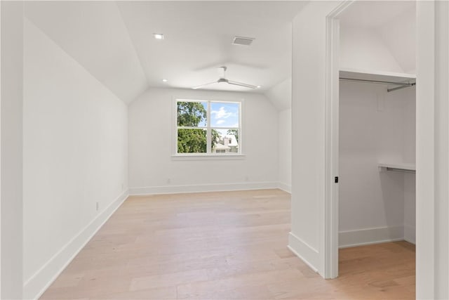 bonus room featuring visible vents, baseboards, lofted ceiling, and light wood-type flooring