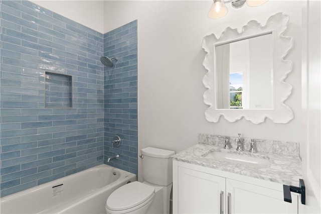 full bath with vanity, toilet, and  shower combination