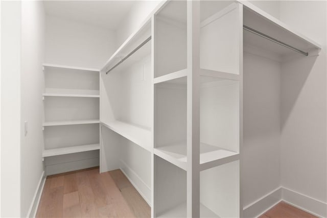 spacious closet with wood finished floors