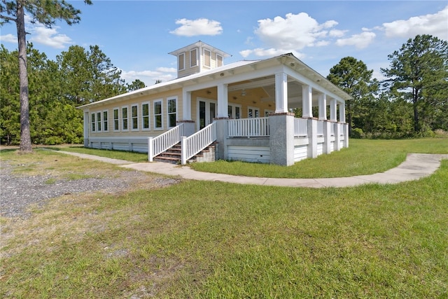 view of front of property featuring a porch and a front lawn