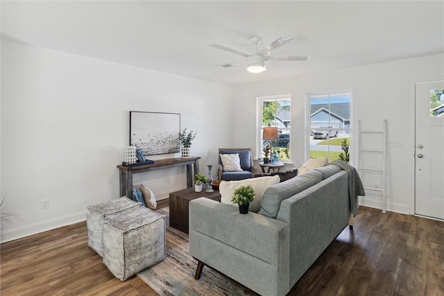 living room featuring dark hardwood / wood-style flooring, plenty of natural light, and ceiling fan