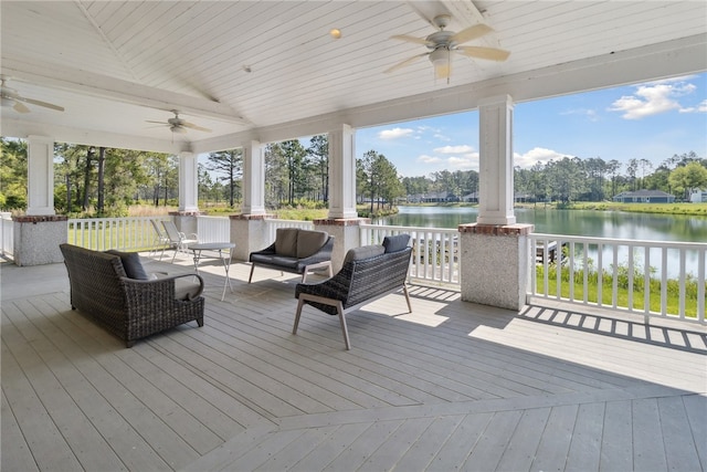 wooden terrace featuring an outdoor living space, a water view, and ceiling fan