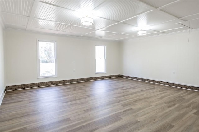 unfurnished room with hardwood / wood-style floors