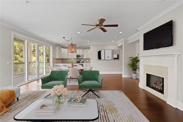 105 Gascoigne Ave Unit 204, Saint Simons Island, GA 31522 - living room featuring ceiling fan, wood finished floors, recessed lighting, crown molding, and a fireplace