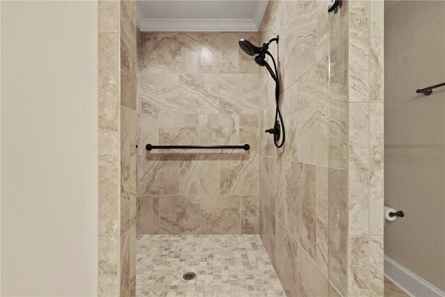 105 Gascoigne Ave Unit 204, Saint Simons Island, GA 31522 - bathroom featuring tiled shower and ornamental molding