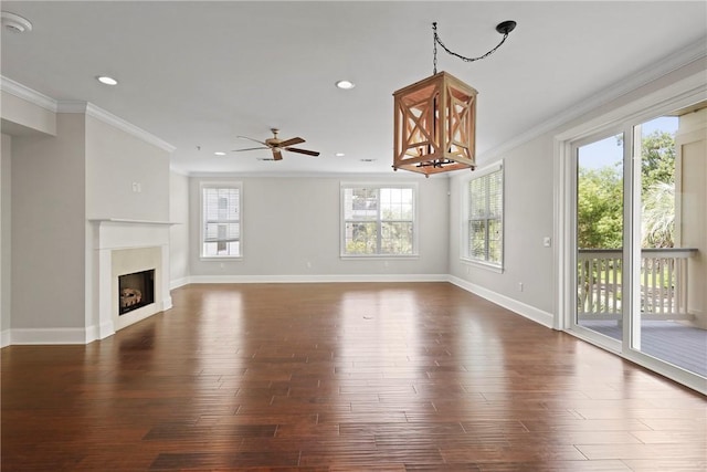 105 Gascoigne Ave Unit 204, Saint Simons Island, GA 31522 - unfurnished living room featuring wood finished floors, ornamental molding, a ceiling fan, a fireplace, and recessed lighting