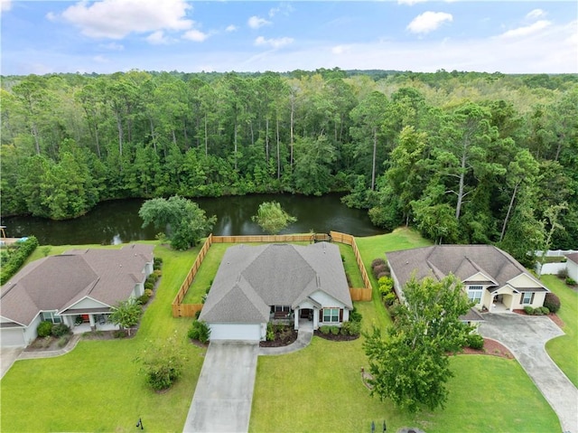 564 Freedom Trl, Brunswick, GA 31525 - ranch-style house with driveway, a garage, a front lawn, and roof with shingles