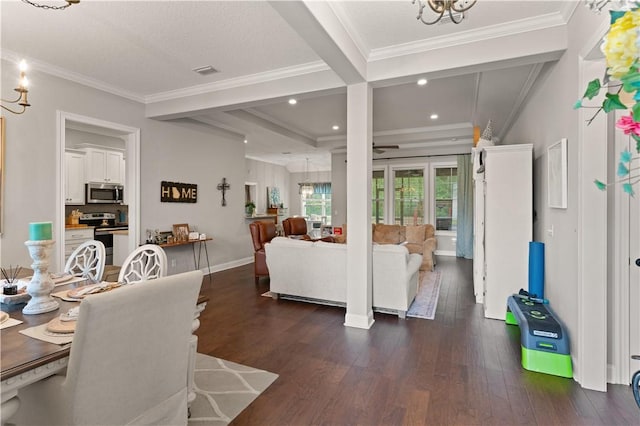 living room featuring crown molding, a chandelier, and dark hardwood / wood-style floors