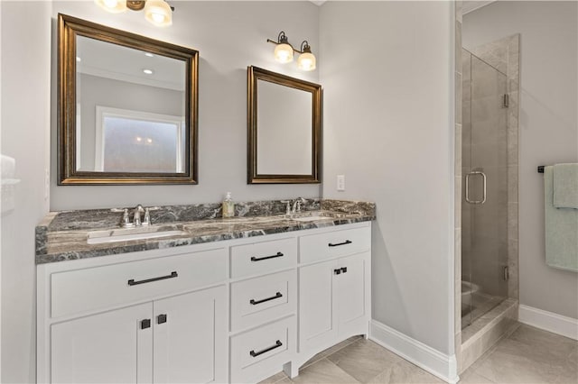 bathroom with tile patterned floors, vanity, and walk in shower