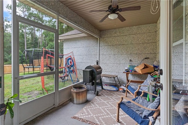 sunroom / solarium with ceiling fan