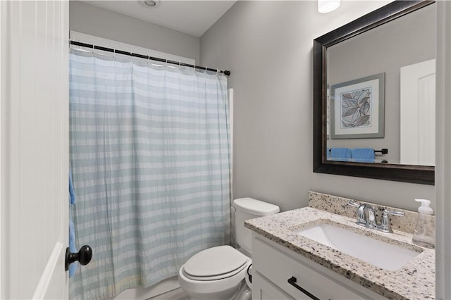 full bathroom featuring vanity, toilet, and shower / tub combo with curtain