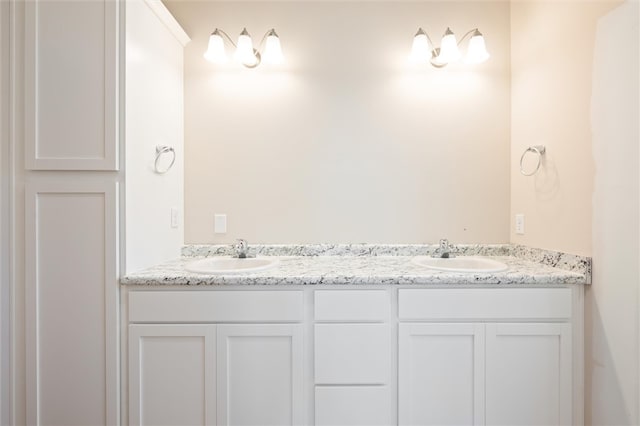 bathroom with double vanity and a sink