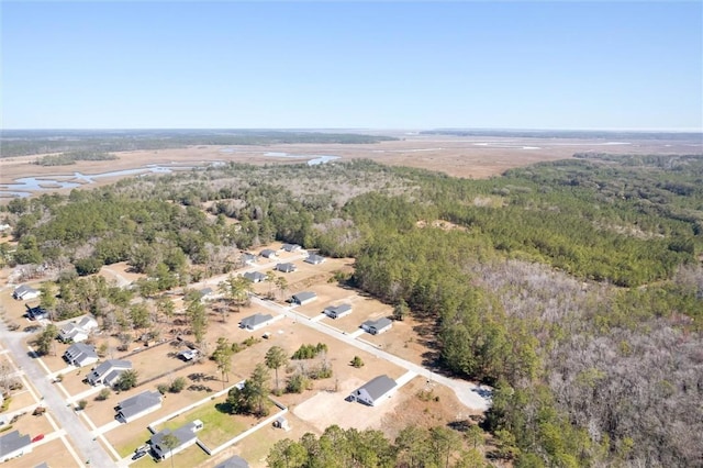 drone / aerial view with a view of trees