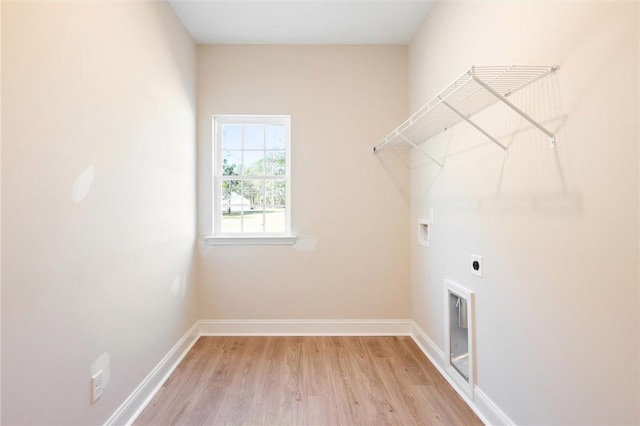 laundry room with laundry area, baseboards, washer hookup, and electric dryer hookup