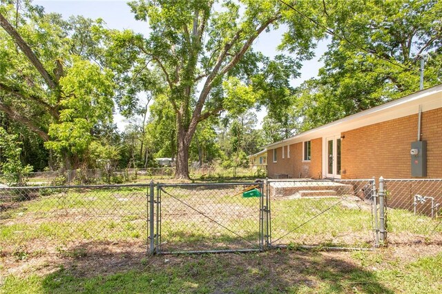 201 Washington Ave, Waycross, GA 31503 - view of yard with a gate and french doors