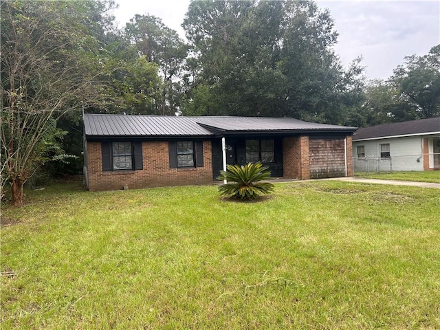 single story home with a front yard