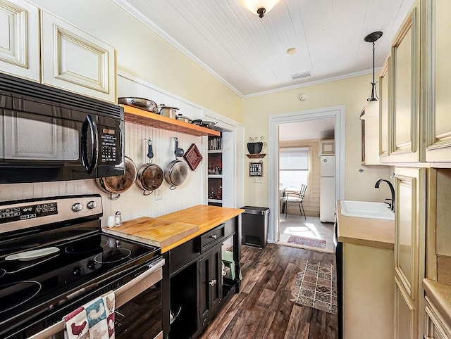 kitchen with butcher block countertops, sink, decorative light fixtures, electric range, and white refrigerator